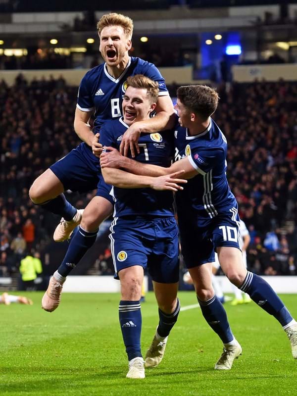 Scotland MNT celebrate scoring a goal.
